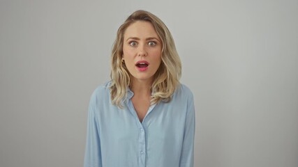 Poster - Shocked blonde woman in white shirt, young, afraid and excited, her face a portrait of amazed fear and astonishing wow on isolated background