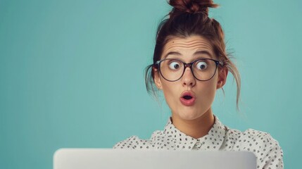Poster - Confident businesswoman looking at a laptop screen. Plenty of copy space on the right side.