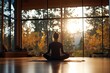 © woters - Person practicing yoga in a serene studio at sunset with trees in the background