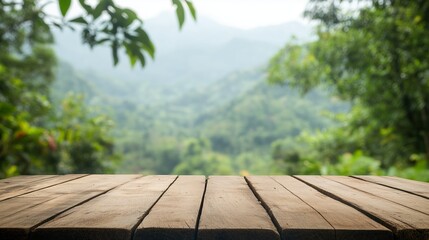 Poster - Wooden table overlooking a lush green landscape in the mountains during daylight