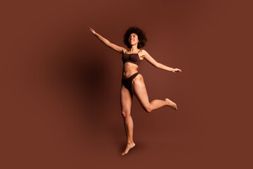 Poster - Full length photo of funky carefree lady underwear jumping loving body positive isolated brown color background