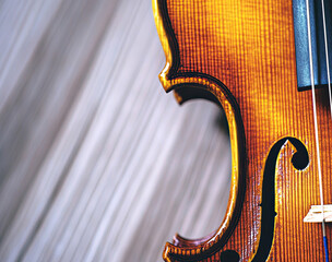 Poster - Close-up of Strings and Bow on a Violin Against a Textured Background
