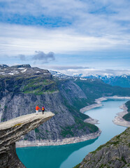 Wall Mural - Two Hikers on the Trolltunga Cliff in Norway