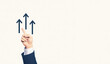 © Robert Kneschke - Hand pointing to three upward arrows symbolizing growth and progress in business or career success