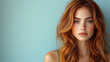 © David - A beautiful female model with long, wavy auburn hair, wearing a sleek green dress, posing on a light blue background