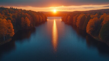 Wall Mural - Golden sunset reflecting on lake water surrounded by autumn forest