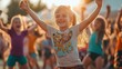 © Prostock-studio - A group of children is dancing energetically in a vibrant outdoor festival, basking in warm sunlight and enjoying the festive atmosphere.