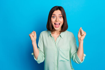 Poster - Photo of ecstatic woman with bob hairstyle dressed turquoise blouse shout yes open mouth win bet isolated on blue color background