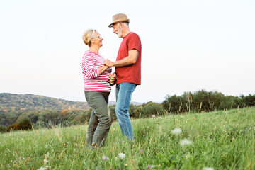 Wall Mural - woman man outdoor senior couple happy lifestyle retirement together smiling love old nature mature