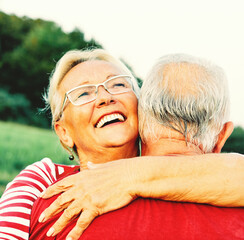 Wall Mural - woman man outdoor senior couple happy lifestyle retirement together smiling love hug nature mature