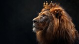 Majestic lion wearing a golden crown poses against a dark background