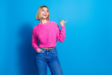 Sticker - Portrait of nice young woman look direct finger empty space wear pink sweater isolated on blue color background