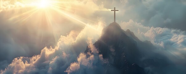 Cross atop a Mountain with Sun Rays Shining Through Clouds