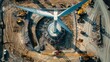 © Cambo27 - Aerial view of wind turbine construction with multiple cranes and workers
