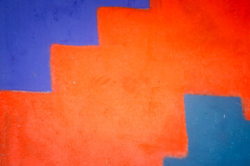 Poster - A blue and red wall with a red and blue stair step. The wall is painted in a way that it looks like a staircase