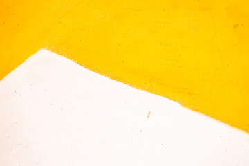 Wall Mural - A yellow and white wall with a white stripe. The wall is a part of a room