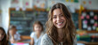 © Aquir - Female teacher. Portrait of a happy teacher in a classroom