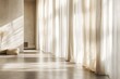 © Elmira - Soft natural light gently filters through floor-to-ceiling linen curtains in a serene, minimalist living room, highlighting the tranquil atmosphere and elegant design
