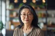 © CojanAI - Portrait of a middle aged woman in startup company office