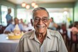 © NikoG - Portrait of a smiling Hispanic senior man celebrating birthday in nursing home