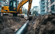 © Curioso.Photography - Excavator digging and laying pipes in an urban construction site.