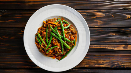 Savory vegan meal with green beans served on white plate