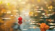 © Bonsales - Fishing float ball in tranquil water with autumn leaves and sunlight reflection, creating a serene and picturesque scene.