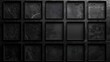 © Олег Фадеев - Textured black surface with a grid of recessed squares, some of which are empty and one of which is filled with a darker shade
