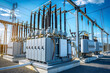 © Prasanth - High voltage power transformer at an electric substation with blue sky background, high voltage, electric current, electrical equipment, substation, distribution
