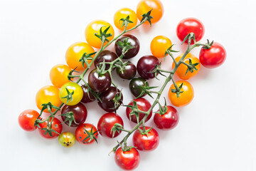 Wall Mural - Colorful Cherry Tomatoes on White Background