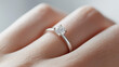 © forenna - A close-up of a wedding ring with a sparkling diamond on a woman's hand, symbolizing marriage and the heartfelt vows exchanged, capturing the essence of commitment and love, photo