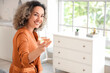 © Pixel-Shot - Beautiful middle-aged woman with glass of wine at home
