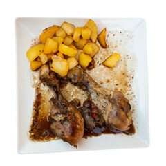 Wall Mural - Appetizing fried chicken served on plate with potatoes and garlic. Isolated over white background