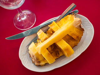 Wall Mural - Beautifully sliced pineapple on white plate, beautiful serving pineapple on festive table