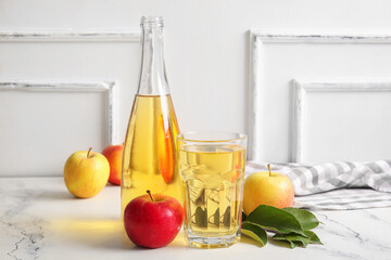 Wall Mural - Composition with fruits, napkin, bottle and glass of fresh tasty apple cider on table