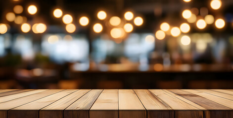 Empty wooden table top with lights bokeh on blur restaurant background.