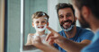 © Prasanth - Shaving cream, bathroom and dad with son or reflection, happy and playful practice for growth or development. Father, boy and mirror in home for learning facial care, grooming and bonding with love.
