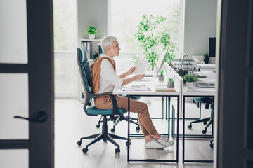 Wall Mural - Full body photo of nice boss mature lady sit table working economist dressed formalwear comfortable light startup office loft room interior