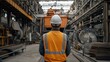 © Krystian - Worker in High-Visibility Vest Overlooking Shipping Containers at Industrial Port