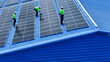© ultramansk - engineer man inspects construction of solar cell panel or photovoltaic cell by electronic device. Industrial Renewable energy of green power. factory worker working on tower roof.