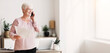 © Prostock-studio - Aged cheerful business woman consulting clients by phone from home, holding papers, free space