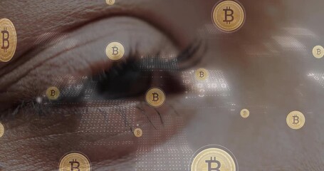 Sticker - Bitcoin symbols and binary code animation over close-up of human eye