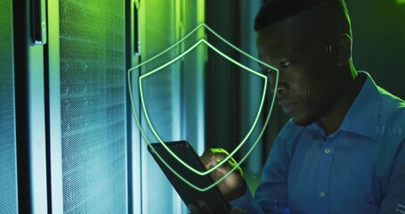 Poster - Cybersecurity shield animation over man using tablet in server room