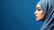 © Sittipol  - Arab women wearing headscarf take shot from side view, studio photo, isolated on background