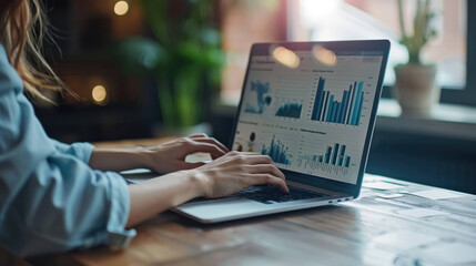 Aufkleber - Professional Woman Analyzing Financial Data on Laptop with Charts and Graphs - Business Analytics Concept