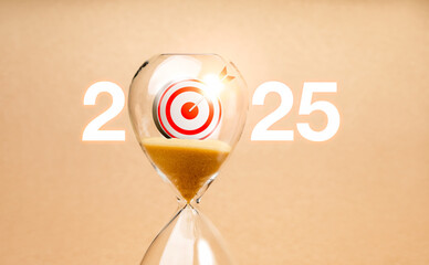 Wall Mural - Coming soon to happy new year 2025, business goal and success concept. 2025 calendar numbers with 3d target icon inside hourglass isolated on eco light brown background, minimal style.