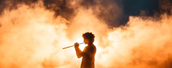 Silhouette of Hindu god Lord Krishna playing flute on sunset. Krishna Janmashtami, Govardhan Puja. Indian religious festival. Background for banner, poster, greeting card with copy space