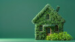 © lermont51 - Sustainable eco friendly house covered in green leaves, green background, copy space