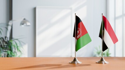 FLAGS OF AFGHANISTAN AND SUDAN ON TABLE