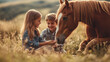 © Chatchanan - A family enjoying a day at the ranch, the children petting and playing with their horse, highlighting their love and connection.